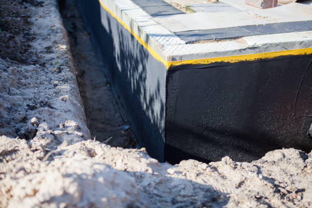 Professional Waterproofing technician working in Milford, IN